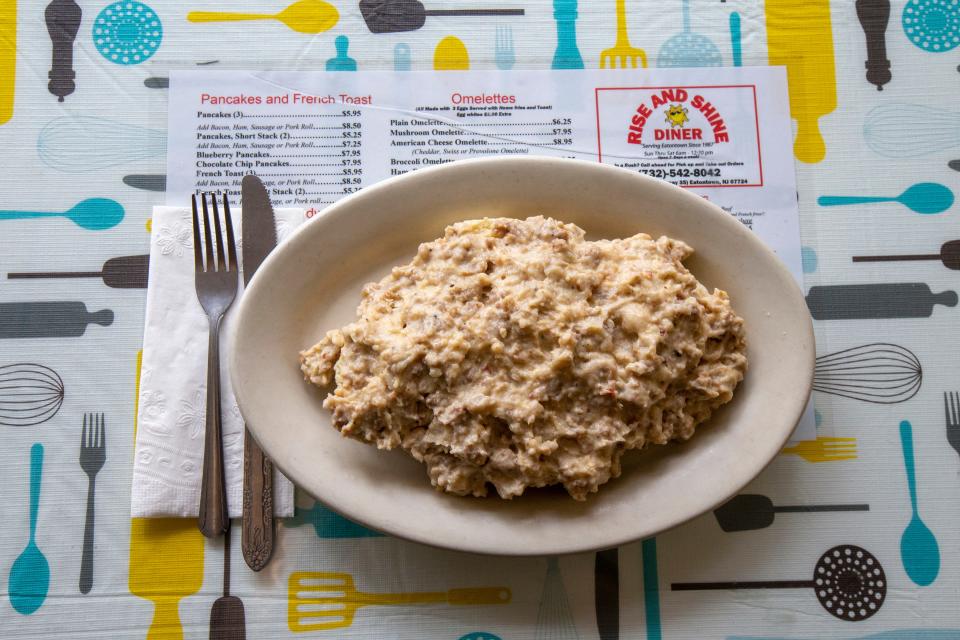 Sal Martorana, owner of Rise N Shine Diner, an Eatontown-based breakfast spot since 1987, features his signature dish, Southern-style biscuits and sausage gravy, in Eatontown, NJ Friday, June 3, 2022.