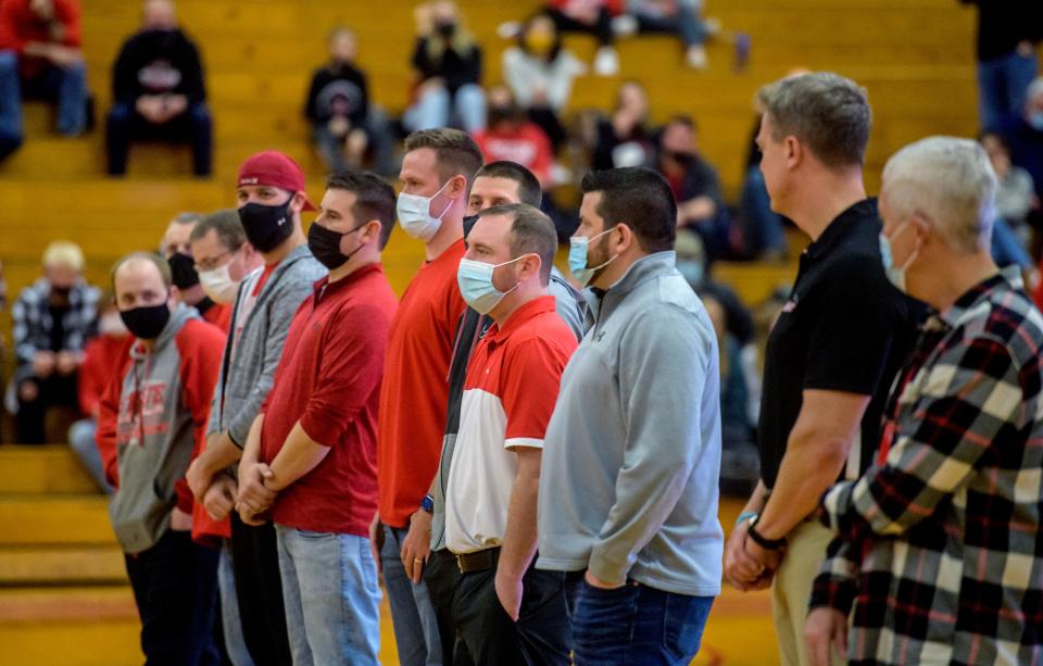 Members of the 2001-2002 Pekin Dragons boys basketball team are introduced during a ceremony in their honor Friday, Jan. 14, 2022 in Pekin. The Dragons fell to the Raiders 43-30.