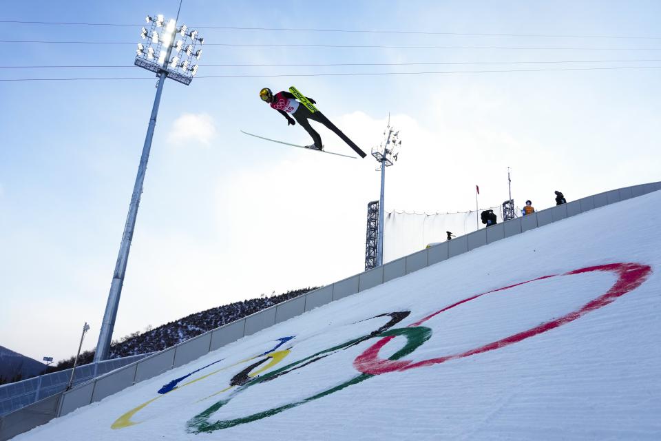 Joergen Graabak, of Norway, soars through the air during the competition round of the individual Gundersen large hill/10km ski jumping competition at the 2022 Winter Olympics, Tuesday, Feb. 15, 2022, in Zhangjiakou, China. (AP Photo/Andrew Medichini)