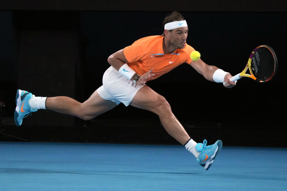 Rafael Nadal of Spain plays a forehand return to Mackenzie McDonald of the U.S., during their second round match at the Australian Open tennis championship in Melbourne, Australia, Wednesday, Jan.18, 2023. (AP Photo/Dita Alangkara)