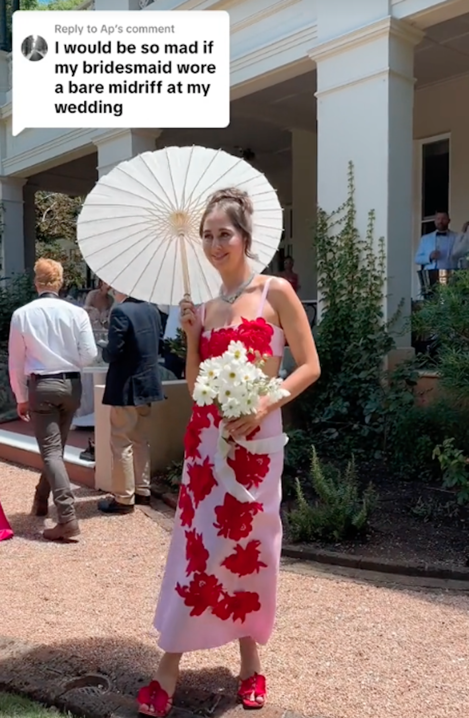 Georgia wearing midriff baring pink bridesmaid dress