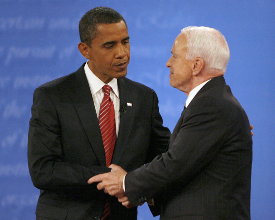 Obama and McCain shake hands after a presidential debate during the 2008 campaign