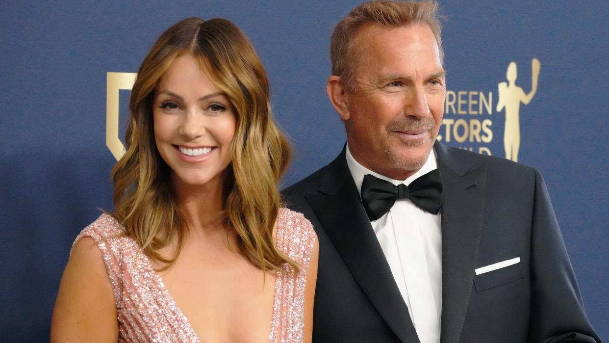   Kevin Costner (R) and Christine Baumgartner attend the 28th Annual Screen Actors Guild Awards at Barker Hangar on February 27, 2022 in Santa Monica, California. 