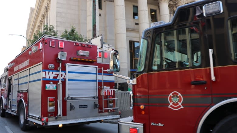 Man brought down from downtown Winnipeg building as darkness falls