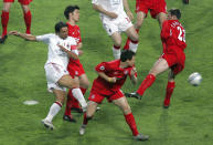 FILE - In this Wednesday May 25, 2005 file photo AC Milan's Paolo Maldini, left, scores the opening goal during the Champions League Final soccer match between AC Milan and Liverpool at the Ataturk Olympic Stadium in Turkey, Istanbul. Q is for Quickest, as in the quickest goal scored in a Champions League final. Milan's Maldini scored in the first minute of the match as his team raced into a 3-0 half-time lead, before Liverpool's miracle comeback and penalty shootout win. (AP Photo/Murad Sezer, File)
