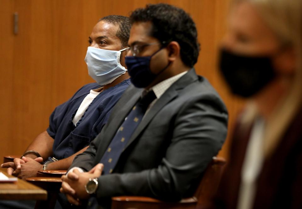 (L to R) Juwan Deering listens along with his attorney Imran Syed of the Michigan Innocence Clinic and Oakland County Prosecutor Karen McDonald in the courtroom of Judge Jeffery Matis at the Oakland County Circuit Court in Pontiac on Tuesday, September 21, 2021.
