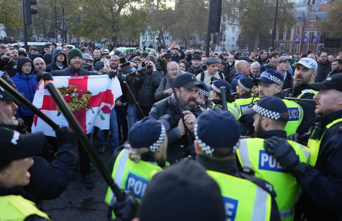 Counter-protesters clash with police in Parliament Square in central London (PA)