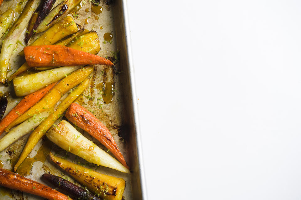 This image released by Milk Street shows a recipe for roasted carrots with the turmeric-infused honey. (Milk Street via AP)