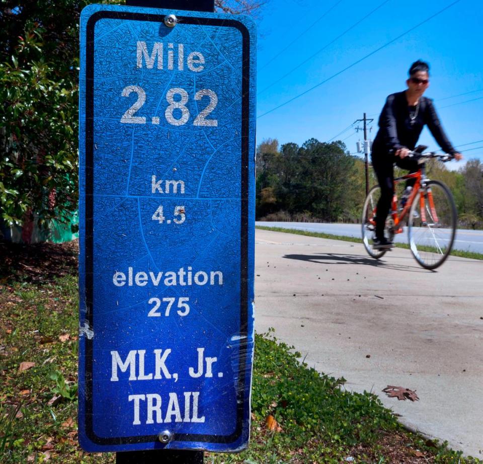 A bicyclist rides along a portion of the Dr. Martin Luther King, Jr. Outdoor Learning Trail in Columbus, Georgia. 03/28/2024