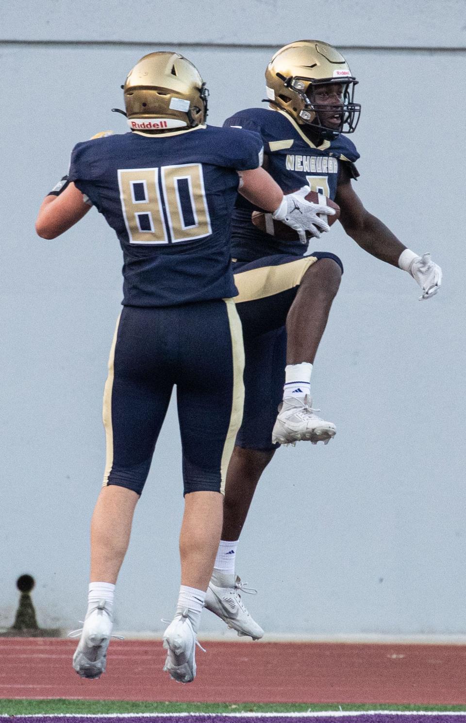 Jashon Thomas of Newburgh Free Academy celebrates a touchdown against New Rochelle with teammate Christopher Leggett during a varsity football game at New Rochelle High School Sept. 1, 2023. Newburgh defeated New Rochelle 28-6.