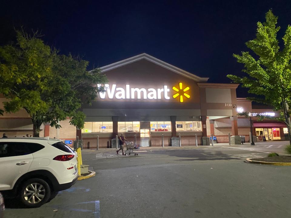 The exterior of a walmart from the parking lot
