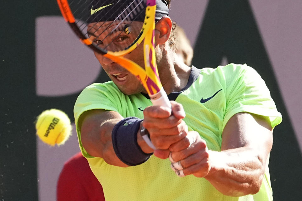 Spain's Rafael Nadal returns the ball to Argentina's Diego Schwartzman during their quarterfinal match of the French Open tennis tournament at the Roland Garros stadium Wednesday, June 9, 2021 in Paris. (AP Photo/Michel Euler)