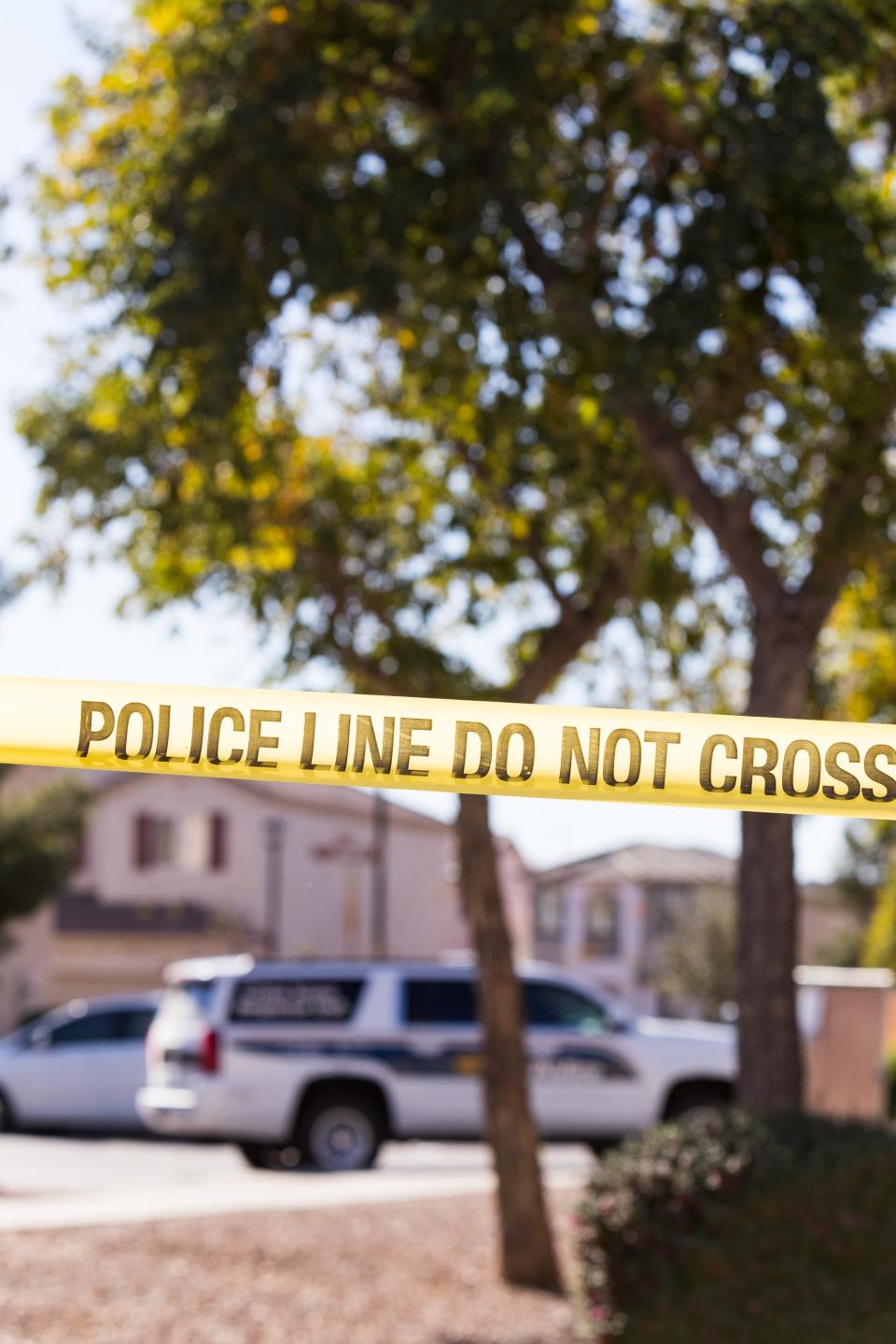 Yellow tape surrounds the scene, pictured on Feb. 12, 2022, at a home where a barricade standoff occurred that led to a shooting involving multiple Phoenix police officers on the morning of Feb. 11, 2022.