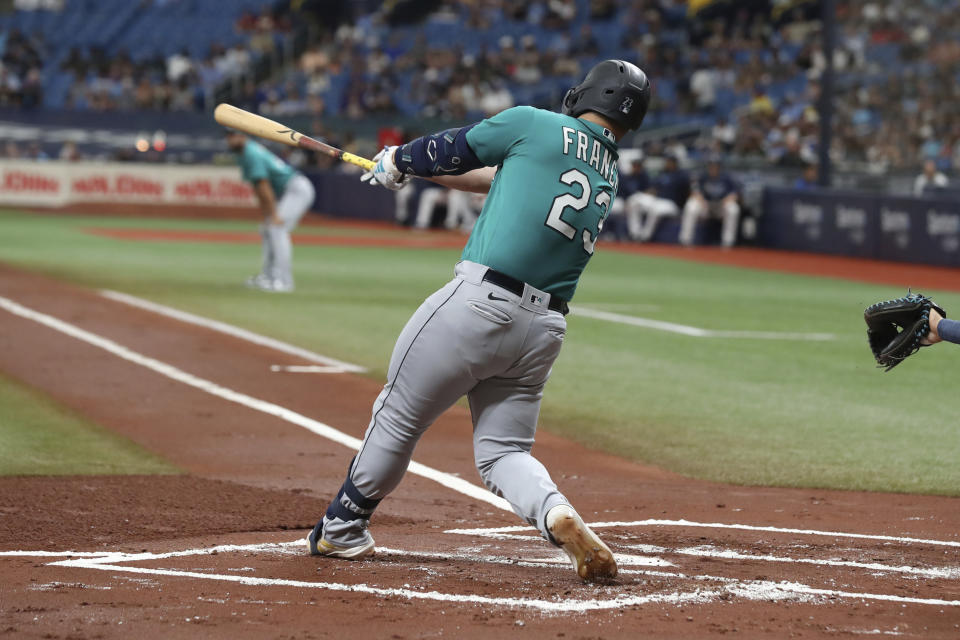 Seattle Mariners' Ty France hits a two-run RBI single against the Tampa Bay Rays during the first inning of a baseball game Saturday, Sept. 9, 2023, in St. Petersburg, Fla. (AP Photo/Scott Audette)