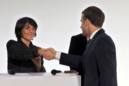 French President Emmanuel Macron shakes hands with Florence Foresti, French humorist and patron of association 'Women Safe', during the International Day for the Elimination of Violence Against Women, at the Elysee Palace in Paris, France, November 25, 2017. REUTERS/Ludovic Marin/Pool