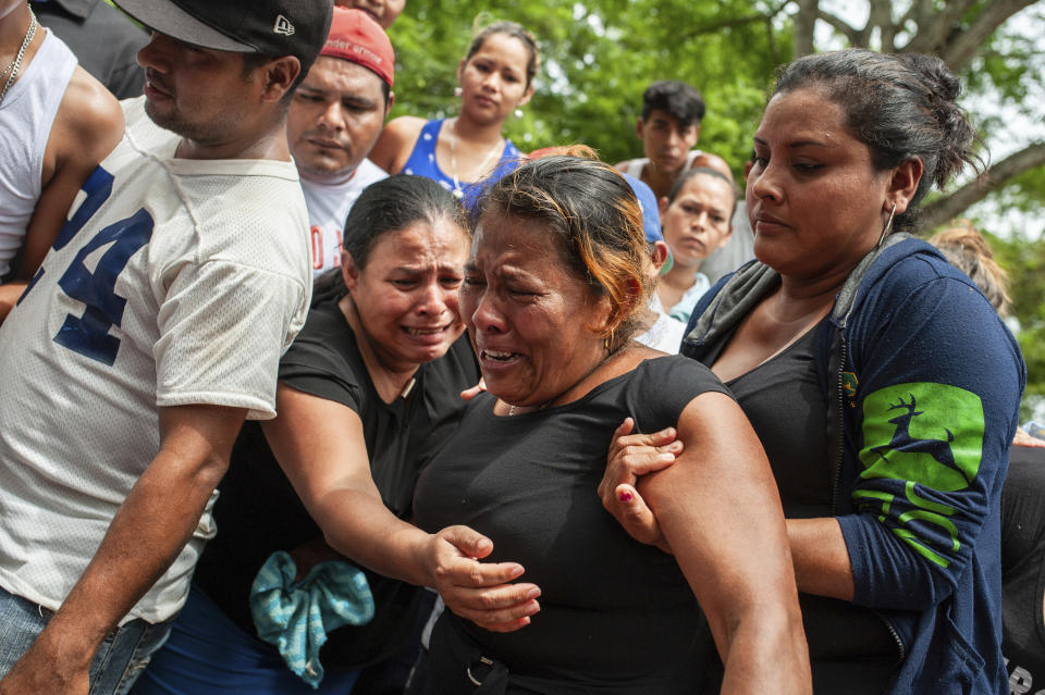 FILE - The sister of Jose Esteban Sevilla Medina, who died after he was shot in the chest at a barricade during an attack by the police and paramilitary forces, cries at his burial in Masaya, Nicaragua, July 16, 2018. A social security reform in 2018 triggered massive protests backed by businesspeople, Catholic leaders and other sectors. The government’s response was a crackdown by security forces and allied civilian militias in which at least 355 people were killed. (AP Photo/Cristobal Venegas, File)