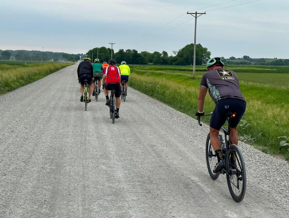 Riders take a gravel detour into Colfax during the RAGBRAI route inspection ride Thursday.