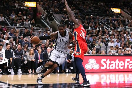 Nov 3, 2018; San Antonio, TX, USA; San Antonio Spurs power forward LaMarcus Aldridge (12) drives to the basket while guarded by New Orleans Pelicans power forward Julius Randle (30) during the first half at AT&T Center. Soobum Im-USA TODAY Sports