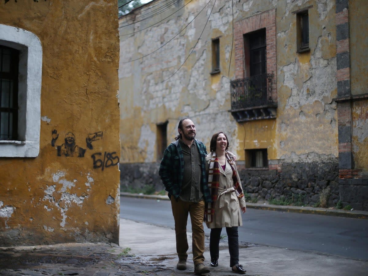 Alejandra, 44, an education policy consultant and Razhy, 48, a journalist and a human rights activist, walk on a street in the Coyoacan neighbourhood, in Mexico City, Mexico, February 9, 2018. The couple met in Mexico City in 1998, after Razhy was kidnapped and quit his job as a director of a weekly magazine in Oaxaca, a state south of the country. Months later, Alejandra traveled to Europe to study. 