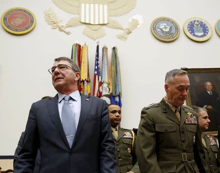 U.S. Defense Secretary Ash Carter (L) and Joint Chiefs Chairman Marine Corps Gen. Joseph Dunford Jr., arrive to testify before a House Armed Services Committee hearing on "U.S. Strategy for Syria and Iraq and its Implications for the Region" in Washington December 1, 2015. REUTERS/Gary Cameron