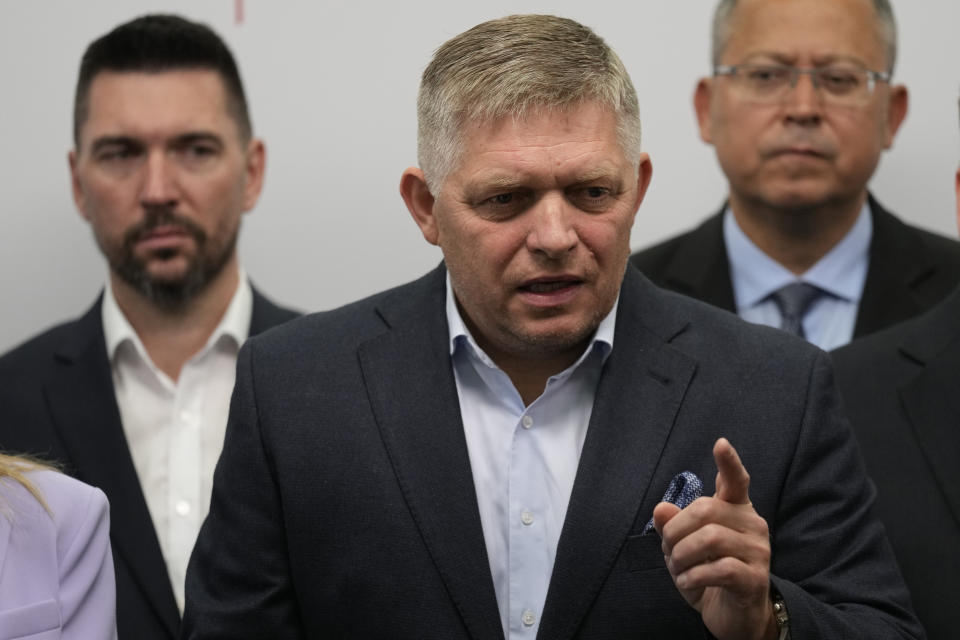 FILE - Chairman of Smer-Social Democracy party Robert Fico, center, adresses the results of an early parliamentary election during a press conference in Bratislava, Slovakia, Sunday, Oct. 1, 2023. On Wednesday Oct. 11, 2023, Fico and his winning party in Slovakia's last month parliamentary election signed a memorandum with two other parties to form a new coalition government. (AP Photo/Darko Bandic, File)