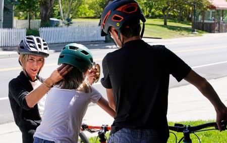 Kelly Pfaff prepares her 11-year-old daughter and 14-year-old son for a bike ride from their home in Park City