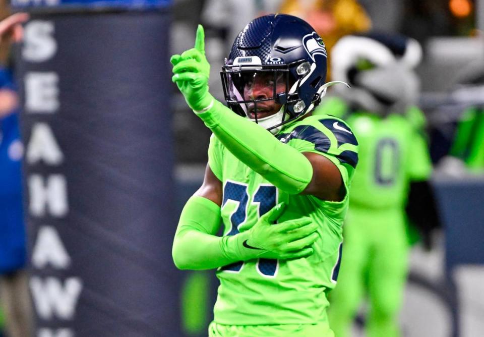 Seattle Seahawks cornerback Devon Witherspoon (21) reacts to a broken up pass against the San Francisco 49ers during the second quarter of the game at Lumen Field, Thursday, Nov. 23, 2023, in Seattle, Wash.