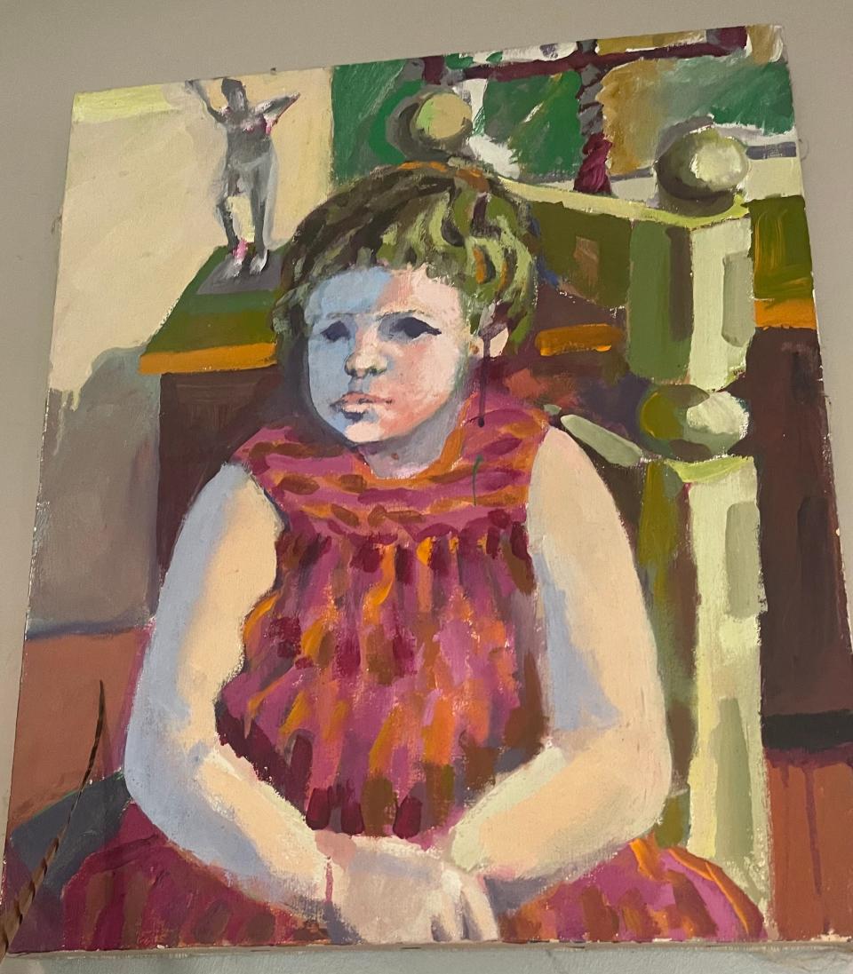 A painting of Jenny Green as a young girl hangs in her Indianapolis home. The portrait was painted by her father, Ed Barker.