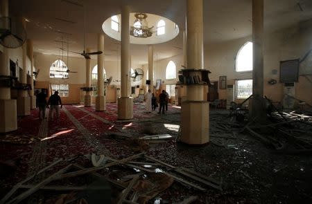 Palestinians inspect Sheikh Zayed mosque that was damaged by Israeli air strikes in Gaza City, July 15, 2018. REUTERS/Suhaib Salem