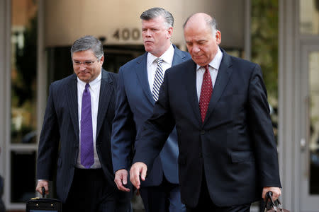 Defense attorneys Richard Westling, Kevin Downing and Thomas Zehnle arrive at the U.S. District Courthouse as jury deliberations are set to begin in former Trump campaign manager Paul Manafort's trial on bank and tax fraud charges stemming from Special Counsel Robert Mueller's investigation of Russia's role in the 2016 U.S. presidential election, in Alexandria, Virginia, U.S., August 16, 2018. REUTERS/Chris Wattie