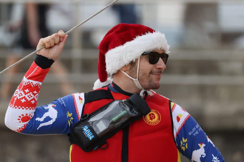 A surf lifesaver wears a Santa hat on Christmas Day at Bondi Beach in Sydney