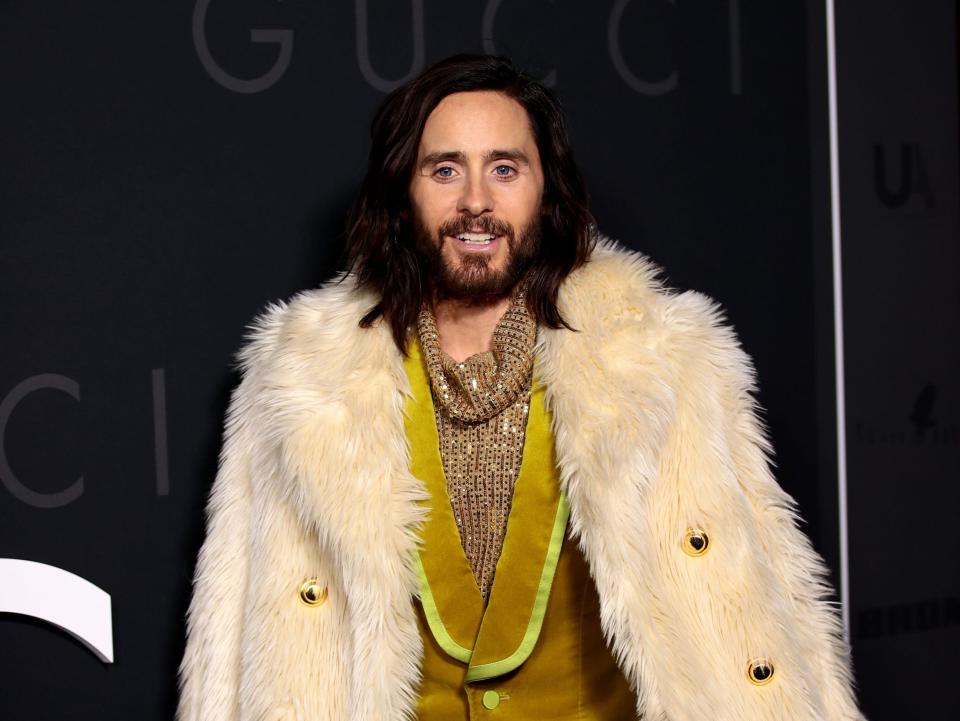 Jared Leto in a gold suit and fur coat