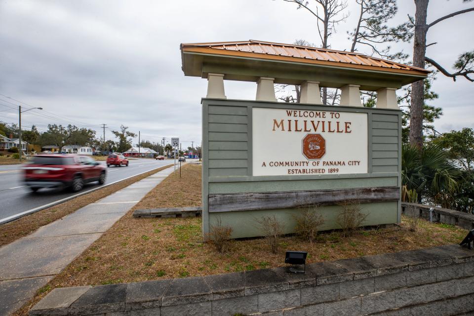 A large sign on U.S. 98 welcomes travelers heading into Millville and thanks those heading west for visiting.