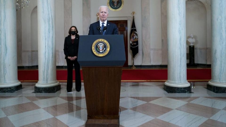 U.S. President Joe Biden makes remarks as Vice President Kamala Harris looks on in response to the verdict in the murder trial of former Minneapolis police officer Derek Chauvin at the Cross Hall of the White House April 20, 2021 in Washington, DC. (Photo by Doug Mills-Pool/Getty Images)
