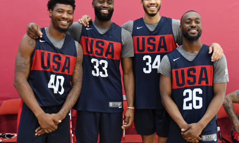 USA basketball players pose for a photo.