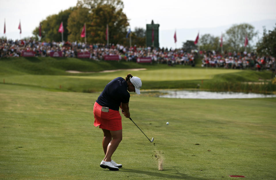 FILE - In this Sept. 16, 2018, file photo, Angela Stanford plays an approach shot on the 18th hole during the fourth round of the Evian Championship women's golf tournament in Evian, eastern France. The LPGA Tour has lost its first major because of the COVID-19 pandemic. The tour says the Evian Championship has been canceled this year because of travel and border restrictions in France. (AP Photo/Francois Mori, File)