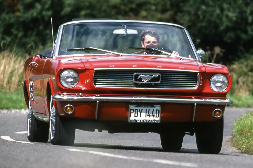 <p>Four seats and a sporty image were always intended for the Mustang: it would be a family car with gusto. Born from the second-generation Ford Falcon, the Mustang was a sporty offspring and it was fully customisable. The cockpit was shoved back, the bonnet - stretched, and its rear was short. Racing was big in the 1960s, therefore the Mustang had to appeal to racing enthusiasts, so Ford also made it as a two-seater.</p><p>Carroll Shelby then joined the party and took <strong>100</strong> of the first 2+2 cars and turned them into<strong> GT 350</strong> models, more were built afterwards. During the transition, Shelby removed the rear seats, added larger front brakes, a fibreglass bonnet and chunkier tyres, alongside various other performance enhancements.</p>