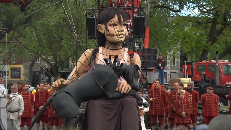 Marionettes as tall as houses march along Montreal streets during 375th birthday bash