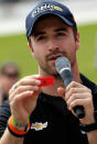 FORT WORTH, TX - MAY 21: IZOD IndyCar Series driver James Hinchcliffe reads the name printed on a raffle ticket during a drawing for a 2012 Chevrolet Camaro on May 21, 2012 at Texas Motor Speedway in Fort Worth, Texas. The Camaro was awarded to a Northwest ISD student for their outstanding academic efforts and attendance throughout the school year. (Photo by Tom Pennington/Getty Images for Texas Motor Speedway)