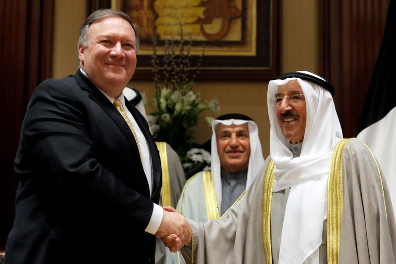 FILE PHOTO: U.S. Secretary of State Mike Pompeo shakes hands with Kuwait's Emir Sheikh Sabah Al-Ahmad Al- Jaber Al-Sabah, in Kuwait City