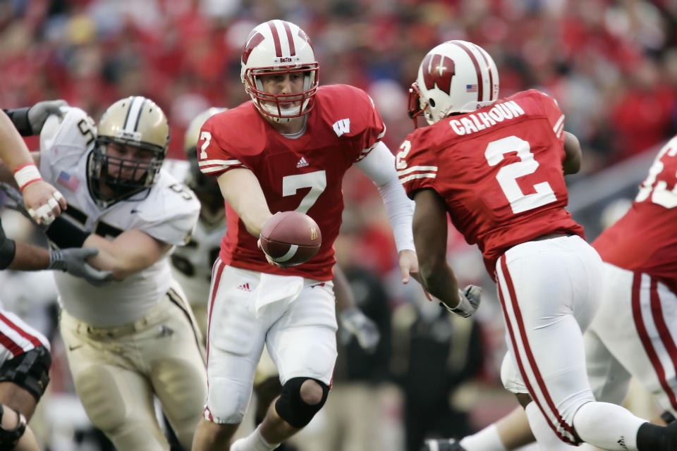 October 22, 2005; Madison, WI, USA; John Stocco #7 hands off to Brian Calhoun #2 of the <a class="link " href="https://sports.yahoo.com/ncaaf/teams/wisconsin/" data-i13n="sec:content-canvas;subsec:anchor_text;elm:context_link" data-ylk="slk:Wisconsin Badgers;sec:content-canvas;subsec:anchor_text;elm:context_link;itc:0">Wisconsin Badgers</a> as Brandon Villarreal #55 of the Purdue Boilermakers defends the play during the second quarter at Camp Randall Stadium. Mandatory Credit: Photo By Jeff Hanisch-USA TODAY Sports Copyright (c) 2005 Jeff Hanisch