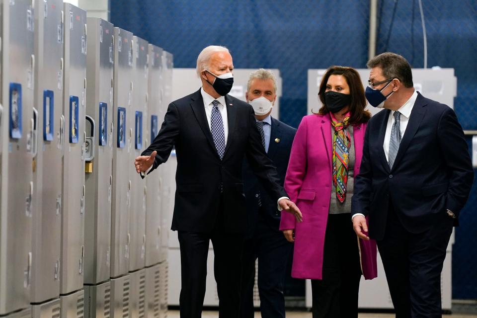 President Joe Biden tours a Pfizer manufacturing site, Friday, Feb. 19, 2021, in Portage, Mich. From left, Biden, Jeff Zients, White House coronavirus response coordinator, Michigan Gov. Gretchen Whitmer and Albert Bourla, Pfizer CEO.