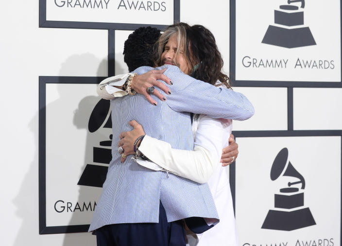 Smokey Robinson, left, and Steven Tyler arrive at the 56th annual Grammy Awards at Staples Center on Sunday, Jan. 26, 2014, in Los Angeles. (Photo by Jordan Strauss/Invision/AP)