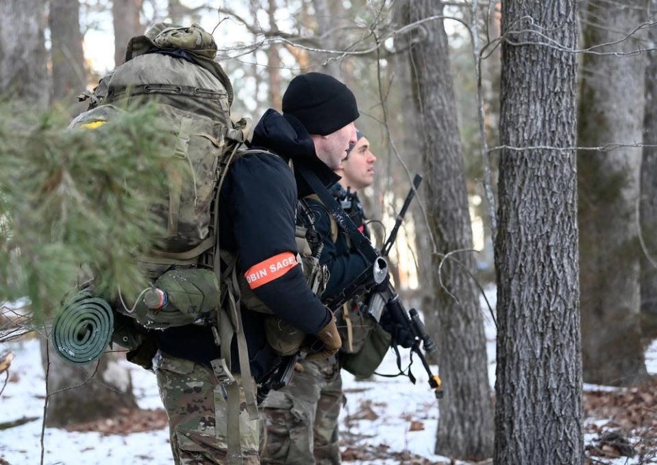 Special Forces candidates assigned to the U.S. Army John F. Kennedy Special Warfare Center and School provide security during the final phase of field training known as Robin Sage on Jan. 23, 2022, in central North Carolina.