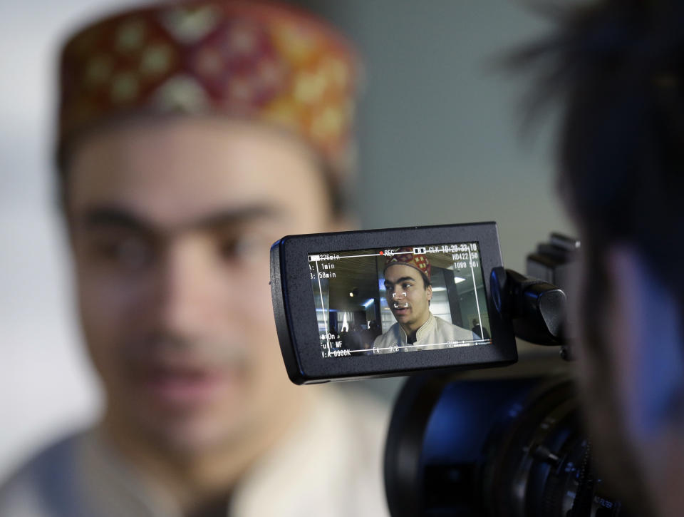 India's Shiva Keshavan is interviewed after speaking at a luncheon at the 2014 Winter Olympics, Tuesday, Feb. 11, 2014, in Sochi, Russia. Keshavan competed in the men's singles luge under the Olympic flag because India's Olympic body had been suspended by the IOC in 2012 over a corruption scandal. The IOC executive board reinstated the Indian Olympic body on Tuesday, Feb. 11, 2014, after it held a weekend ballot that complied with ethics rules barring corruption-tainted officials from running for election. (AP Photo/Morry Gash)