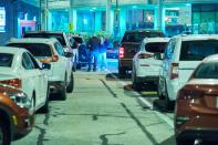 <p>Canadian travelers wait in line to cross the border into the United States across the Rainbow Bridge in Niagara Falls, Ontario, on November 7, 2021, around midnight. - The United States reopens its land and air borders Monday November 8 to foreign visitors fully vaccinated against Covid-19, ending 20 months of restrictions on travel from around the globe that separated families, hobbled tourism and strained diplomatic ties. The ban, imposed by former president Donald Trump in early 2020 and upheld by his successor Joe Biden, has been widely criticized and become emblematic of the upheavals caused by the pandemic. The restrictions were particularly unpopular in Europe and US neighbors Canada and Mexico. (Photo by Geoff Robins / AFP) (Photo by GEOFF ROBINS/AFP via Getty Images)</p> 