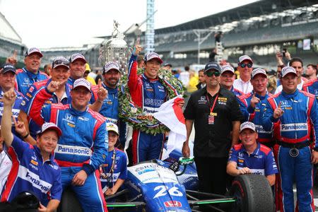 May 28, 2017; Indianapolis, IN, USA; IndyCar Series driver Takuma Sato (left) celebrates with team owner Michael Andretti and crew after winning the 101st Running of the Indianapolis 500 at Indianapolis Motor Speedway. Mandatory Credit: Mark J. Rebilas-USA TODAY Sports