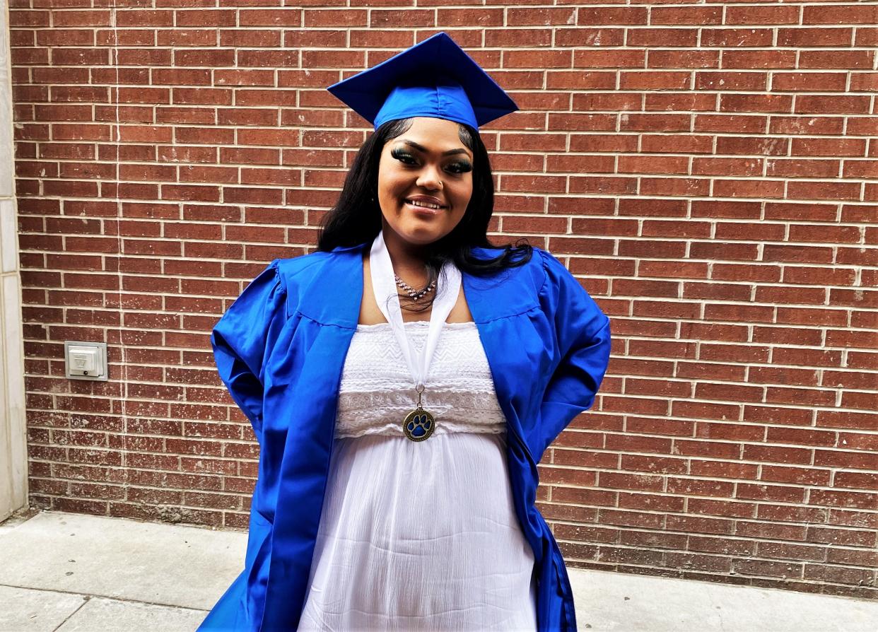 Nayveah Moss on Friday poses before her graduation from Douglass High School.
