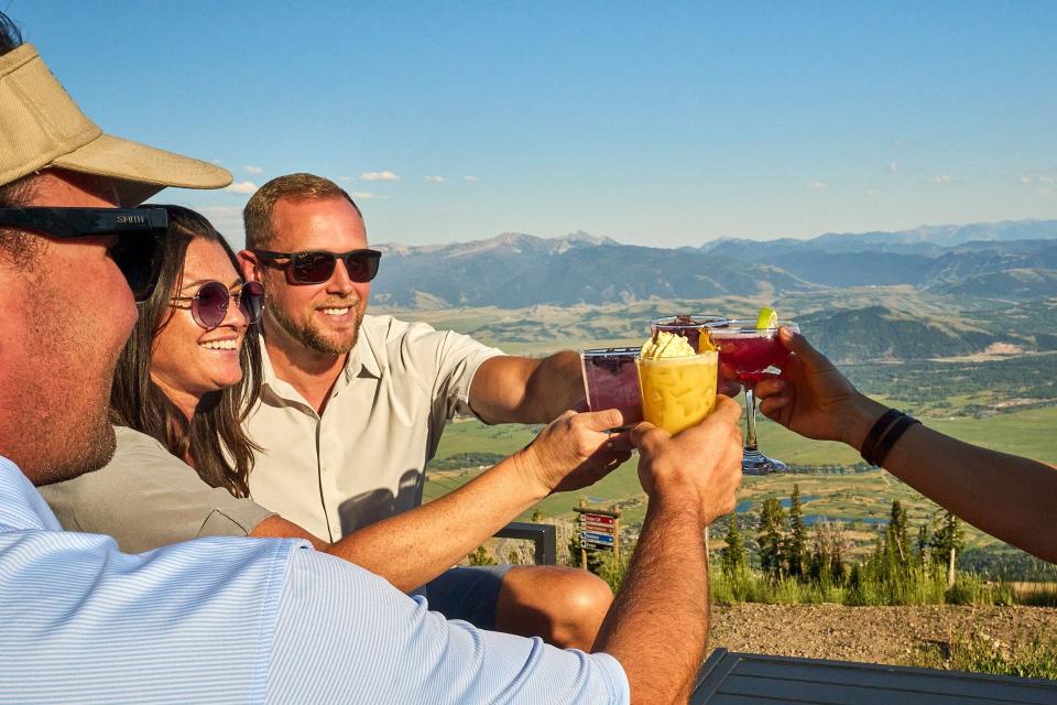 Toast to the spectacular view at Piste Mountain Bistro