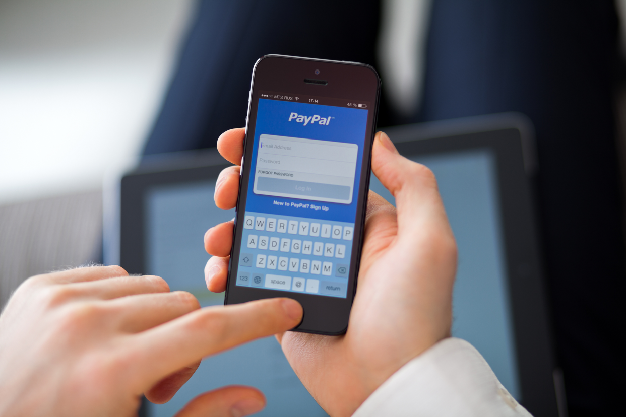 Man using PayPal on his phone